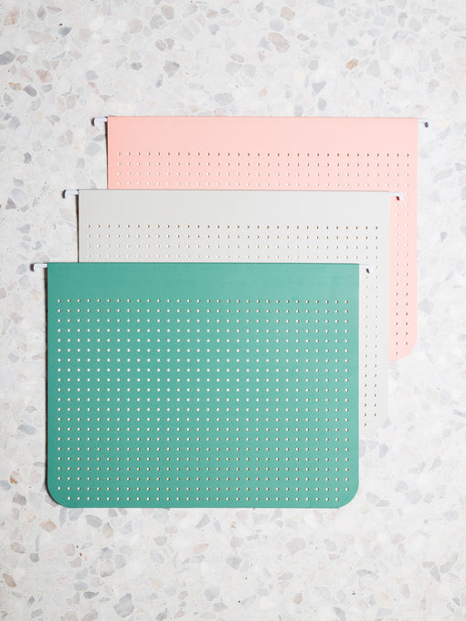 3 perforated hanging file folders in 3 colors on a stone patterned background